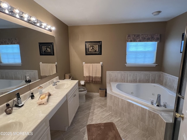 27 Stonehenge Ct, Jackson, NJ 08527 - full bath featuring a whirlpool tub, double vanity, and toilet