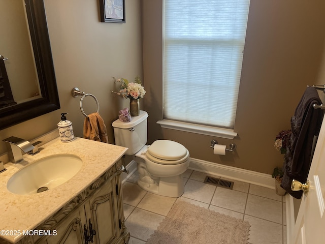 27 Stonehenge Ct, Jackson, NJ 08527 - half bathroom featuring plenty of natural light, toilet, tile patterned flooring, and vanity