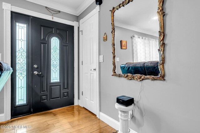 1012 Bismarck St, Toms River, NJ 08757 - entrance foyer featuring crown molding, light wood-style floors, and baseboards
