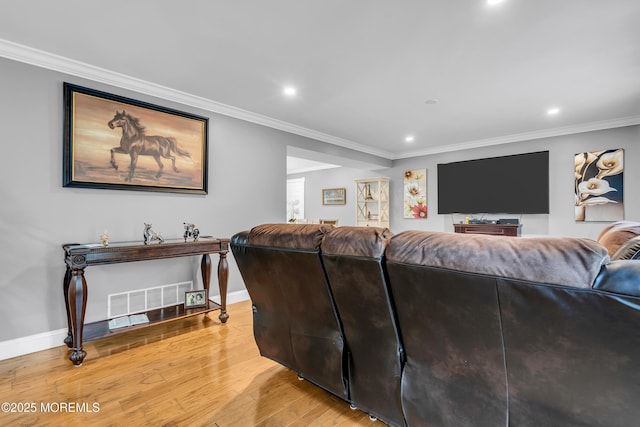 1012 Bismarck St, Toms River, NJ 08757 - living room featuring light wood-style flooring, recessed lighting, ornamental molding, and baseboards