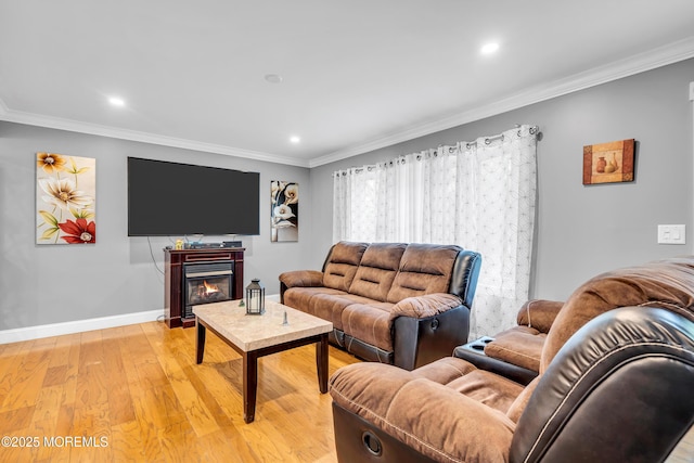 1012 Bismarck St, Toms River, NJ 08757 - living area featuring light wood-style floors, crown molding, recessed lighting, baseboards, and a glass covered fireplace