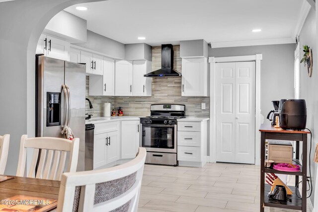 1012 Bismarck St, Toms River, NJ 08757 - kitchen with wall chimney exhaust hood, stainless steel appliances, light countertops, a sink, and ornamental molding