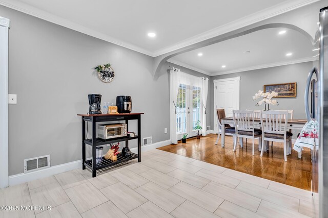 1012 Bismarck St, Toms River, NJ 08757 - dining area with arched walkways, french doors, recessed lighting, baseboards, and ornamental molding