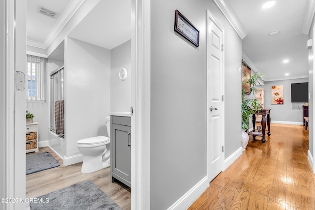 1012 Bismarck St, Toms River, NJ 08757 - corridor featuring light wood finished floors, crown molding, baseboards, and recessed lighting