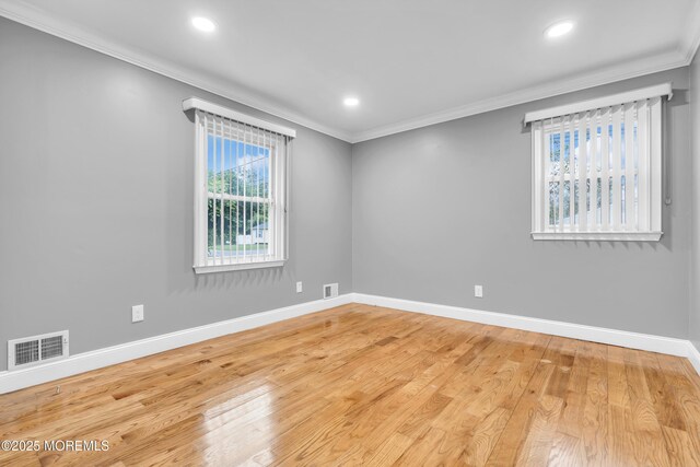 1012 Bismarck St, Toms River, NJ 08757 - spare room with crown molding, baseboards, light wood-type flooring, and recessed lighting