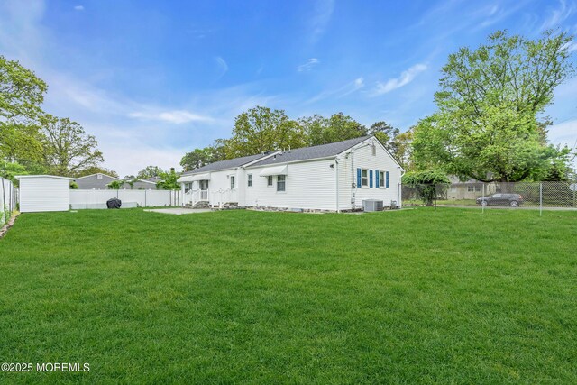 1012 Bismarck St, Toms River, NJ 08757 - rear view of house featuring cooling unit, a patio, and a shingled roof