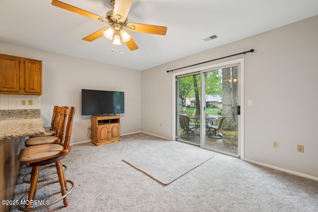 119 Morning Glory, Whiting, NJ 08759 - living room featuring light carpet, baseboards, and ceiling fan