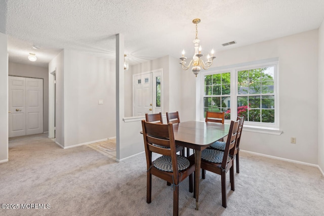 119 Morning Glory, Whiting, NJ 08759 - carpeted dining area featuring a chandelier, baseboards, and a textured ceiling