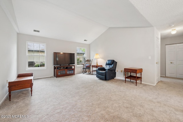 119 Morning Glory, Whiting, NJ 08759 - living area featuring carpet, baseboards, and lofted ceiling