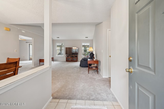 119 Morning Glory, Whiting, NJ 08759 - foyer with light carpet, a textured ceiling, light tile patterned floors, and baseboards