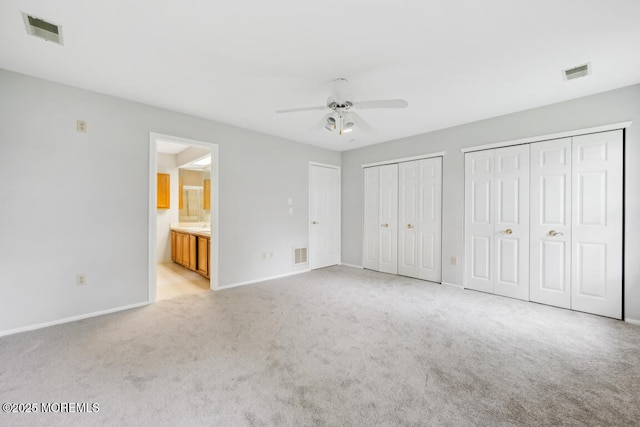 119 Morning Glory, Whiting, NJ 08759 - unfurnished bedroom with light colored carpet, multiple closets, baseboards, ensuite bath, and ceiling fan