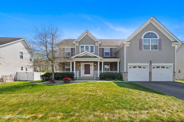 55 Freedom Hills Dr, Barnegat, NJ 08005 - view of front of house featuring stone siding, driveway, a garage, and a porch