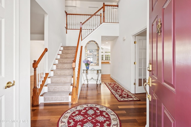 55 Freedom Hills Dr, Barnegat, NJ 08005 - entryway featuring wood finished floors, stairs, a towering ceiling, and baseboards