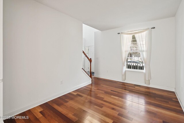 55 Freedom Hills Dr, Barnegat, NJ 08005 - empty room featuring stairway, hardwood / wood-style flooring, and baseboards