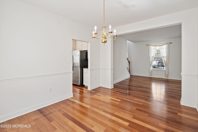 55 Freedom Hills Dr, Barnegat, NJ 08005 - unfurnished dining area featuring light wood-type flooring, a chandelier, and baseboards
