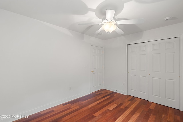 55 Freedom Hills Dr, Barnegat, NJ 08005 - unfurnished bedroom featuring baseboards, dark wood-type flooring, a ceiling fan, and a closet