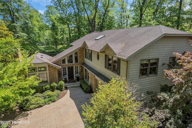 7 Seagull Ln, Lincroft, NJ 07738 - view of front facade with a shingled roof