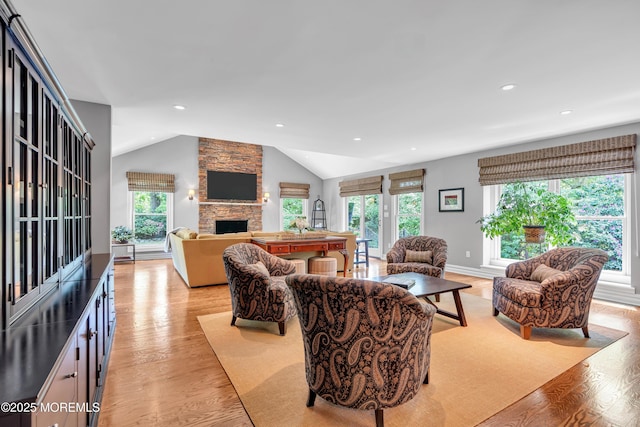 7 Seagull Ln, Lincroft, NJ 07738 - living room featuring light wood finished floors, vaulted ceiling, a stone fireplace, and recessed lighting
