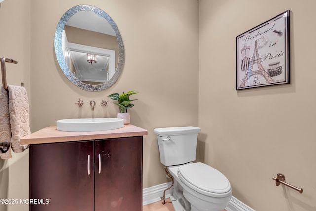 7 Seagull Ln, Lincroft, NJ 07738 - bathroom with toilet, vanity, and baseboards