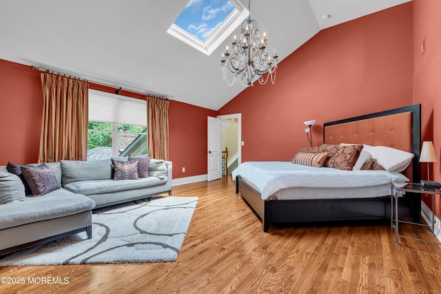 7 Seagull Ln, Lincroft, NJ 07738 - bedroom with a skylight, lofted ceiling, wood finished floors, a chandelier, and baseboards