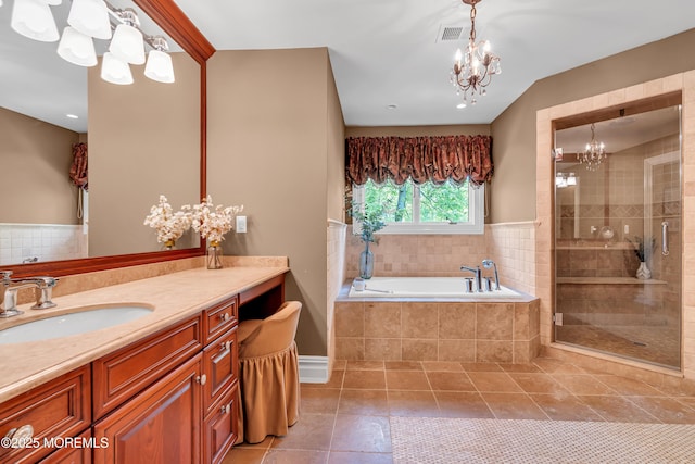 7 Seagull Ln, Lincroft, NJ 07738 - bathroom with a chandelier, tile patterned flooring, a stall shower, a garden tub, and vanity