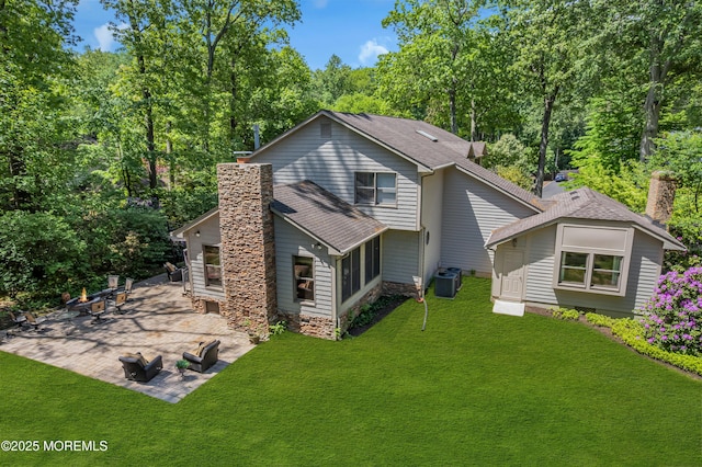 7 Seagull Ln, Lincroft, NJ 07738 - rear view of house with a chimney, a patio area, and a yard