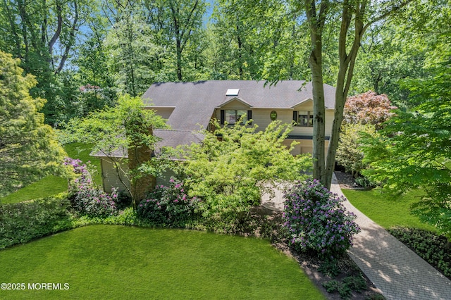 7 Seagull Ln, Lincroft, NJ 07738 - view of front of home with roof with shingles and a front yard