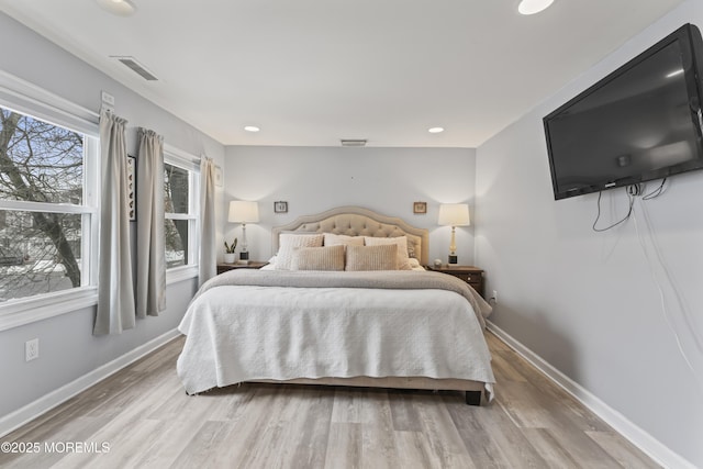 bedroom featuring light wood-type flooring, baseboards, and recessed lighting