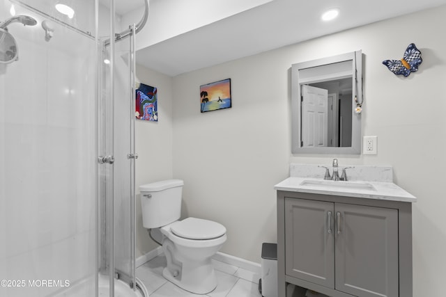 full bath with a stall shower, toilet, vanity, and baseboards