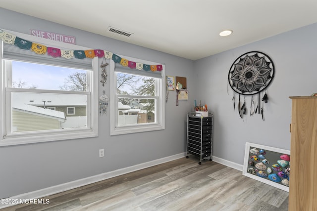 unfurnished room with wood finished floors and baseboards