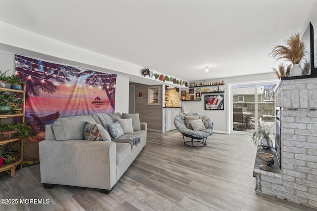 living area with wood finished floors and baseboards