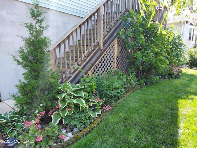 view of green lawn with stairway