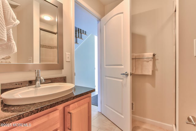 full bathroom with tile patterned floors and vanity
