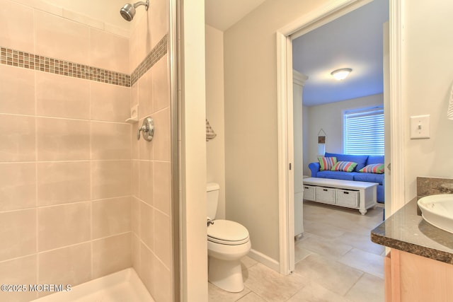 full bathroom featuring tiled shower, toilet, vanity, ensuite bath, and tile patterned flooring
