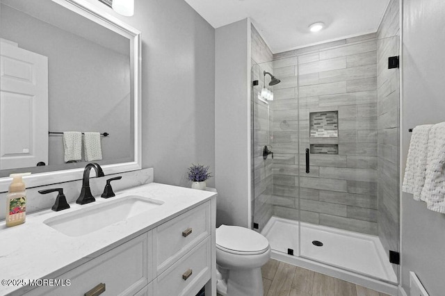 8 Sugar Pine Dr, Jackson, NJ 08527 - bathroom featuring a stall shower, toilet, vanity, and wood finished floors