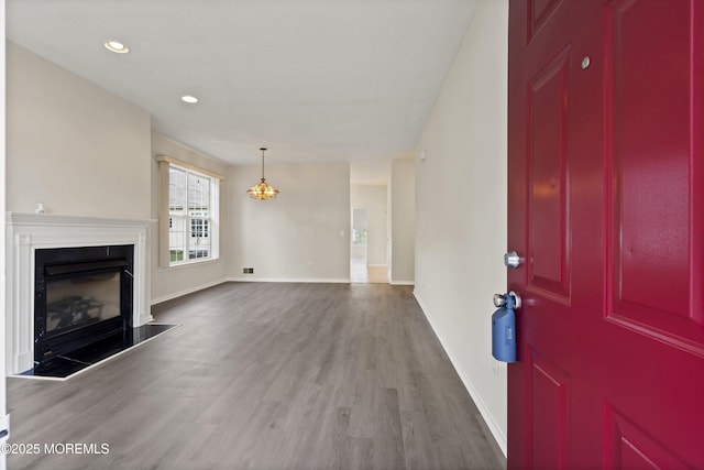 43 Osprey Pl, Barnegat, NJ 08005 - unfurnished living room with wood finished floors, baseboards, a glass covered fireplace, and recessed lighting