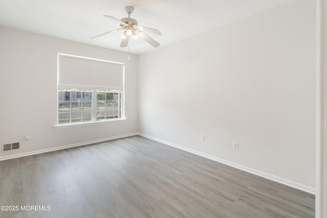 43 Osprey Pl, Barnegat, NJ 08005 - empty room with wood finished floors, a ceiling fan, and baseboards