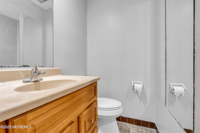 half bath with toilet and vanity