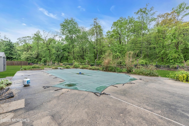 view of swimming pool with a patio area and a fenced backyard