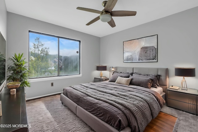 bedroom featuring baseboards and a ceiling fan