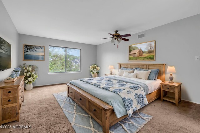 bedroom with carpet, baseboards, and a ceiling fan