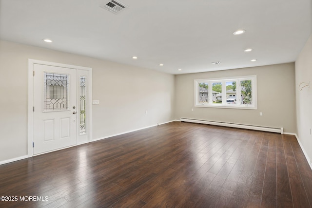 unfurnished room with a baseboard heating unit, dark wood-style flooring, recessed lighting, and baseboards