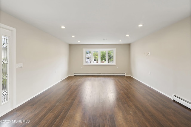 unfurnished room featuring baseboard heating, dark wood-type flooring, recessed lighting, and baseboards