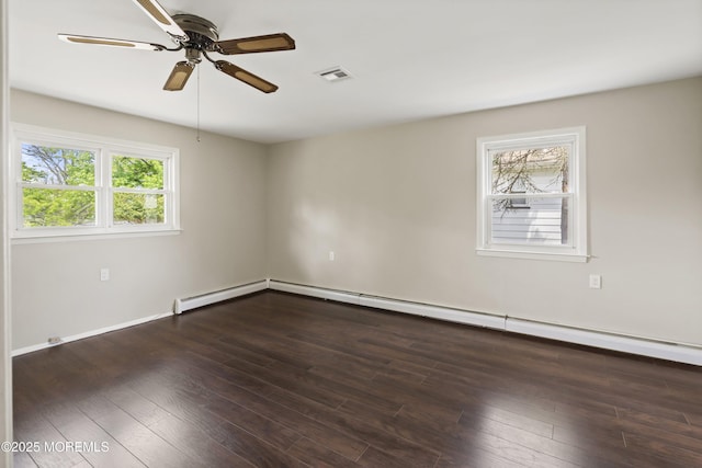 empty room featuring a ceiling fan, wood finished floors, and baseboards