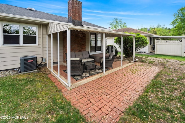 back of house with a patio, central AC unit, a chimney, and outdoor lounge area