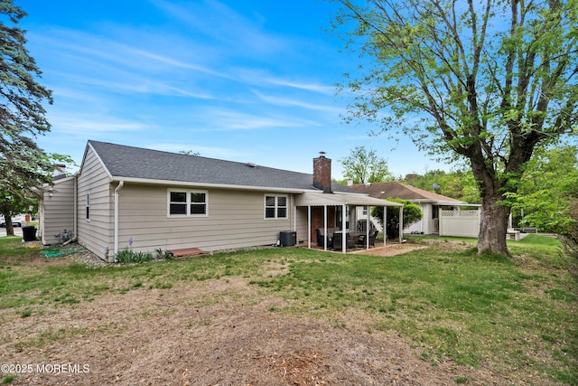 back of house featuring a chimney, a patio, and central AC unit
