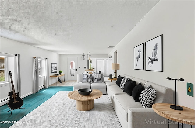 living room featuring baseboard heating, wood finished floors, and baseboards