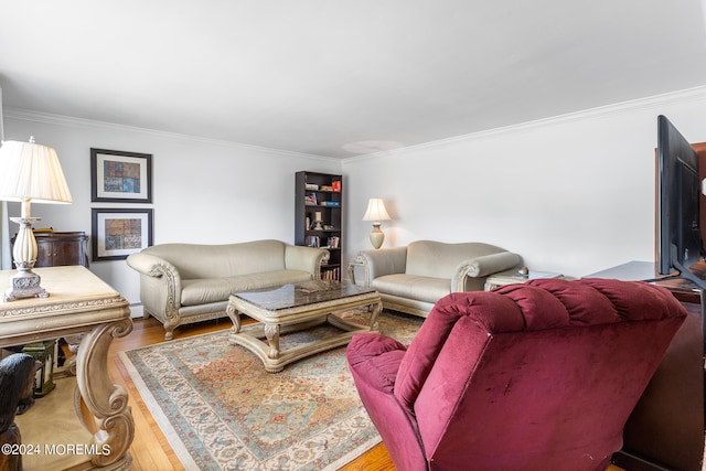 living area with wood finished floors and crown molding