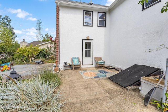 back of house featuring a patio and stucco siding