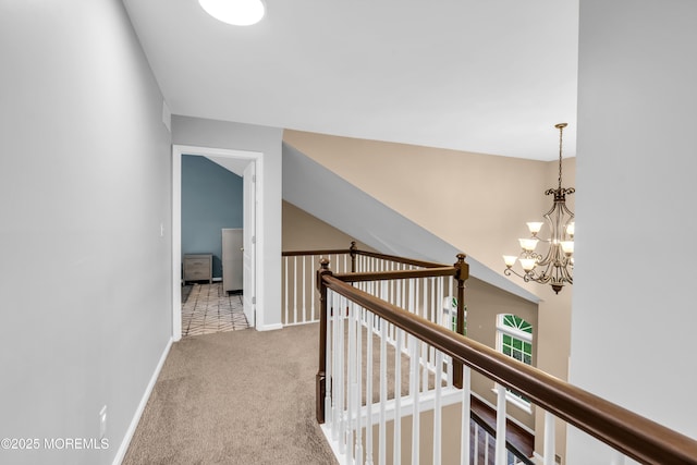 352 Meadowood Rd, Jackson, NJ 08527 - corridor with carpet flooring, an upstairs landing, a chandelier, and baseboards